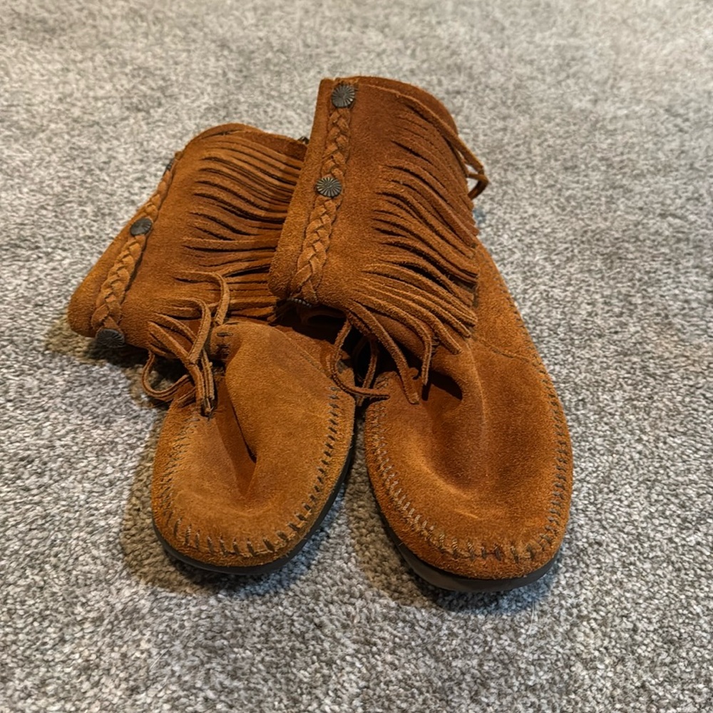 Minnetonka camel colored tassel moccasin boots.